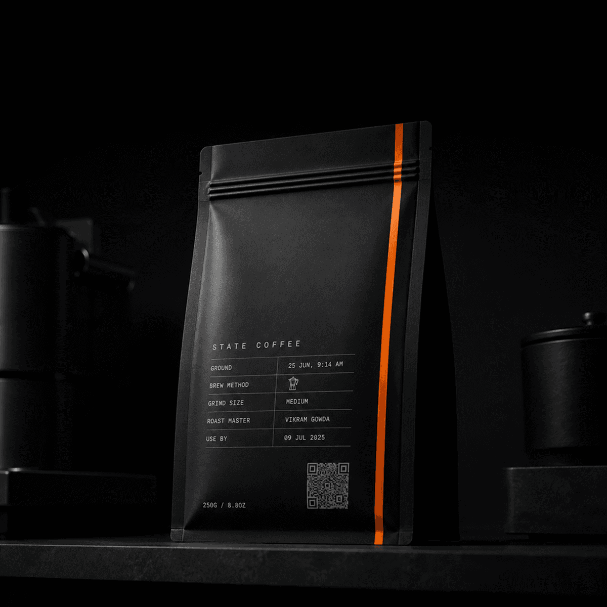 A grinder dispensing freshly ground coffee into an open State Coffee bag.